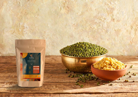 SatRas Desi Summer Moong Dal pouch beside a brass bowl of whole green moong and a clay bowl of cooked yellow moong dal