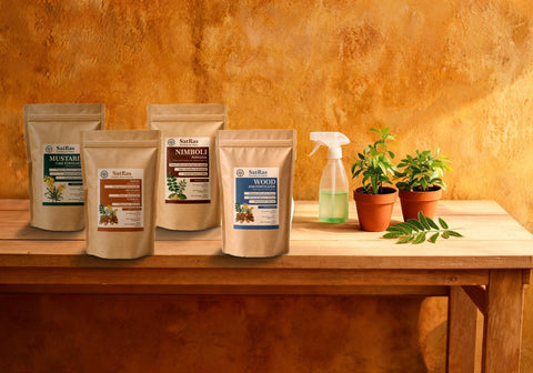 SatRas nimboli neem seed powder with the mustard cake, plant growth promoter and wood ash kraft pouches beside a spray bottle and potted plants